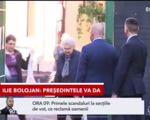 Momentul în care președintele interimar Ilie Bolojan a dat să iasă din curtea școlii unde a votat și s-a oprit Foto: Hotnews.ro